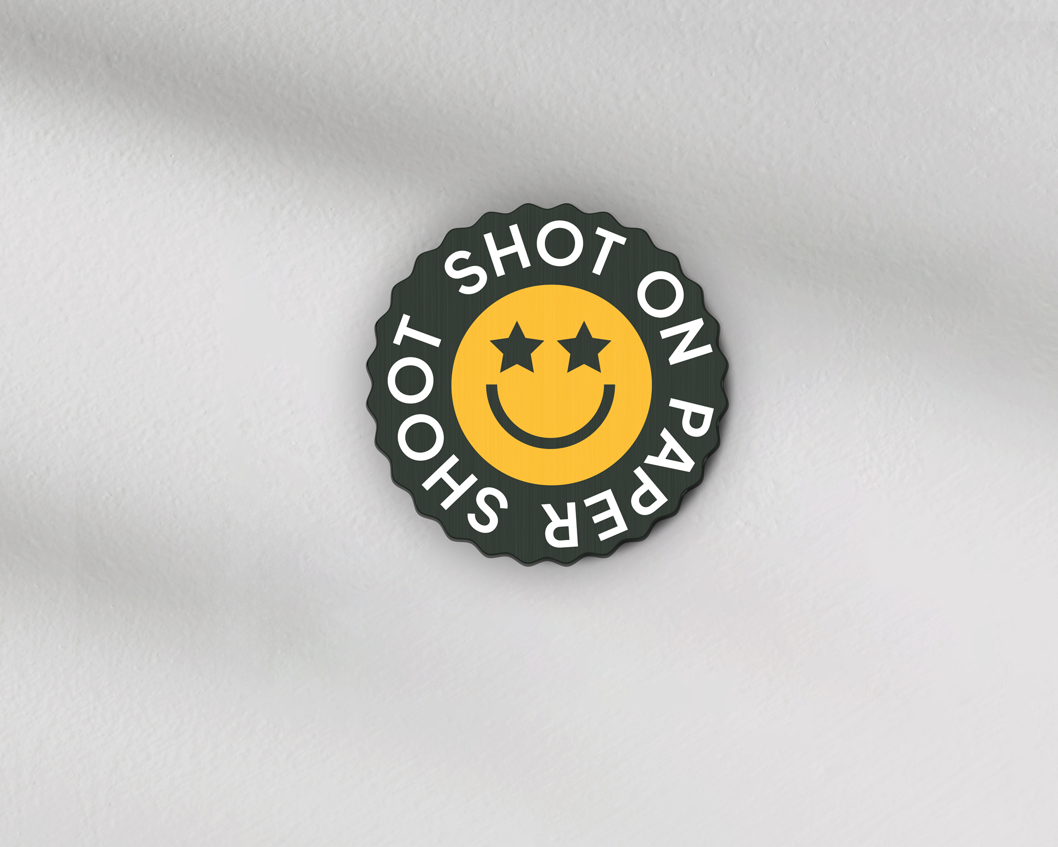 Shot on paper shoot text lens cover with yellow star eyed smiley face with grip groves 