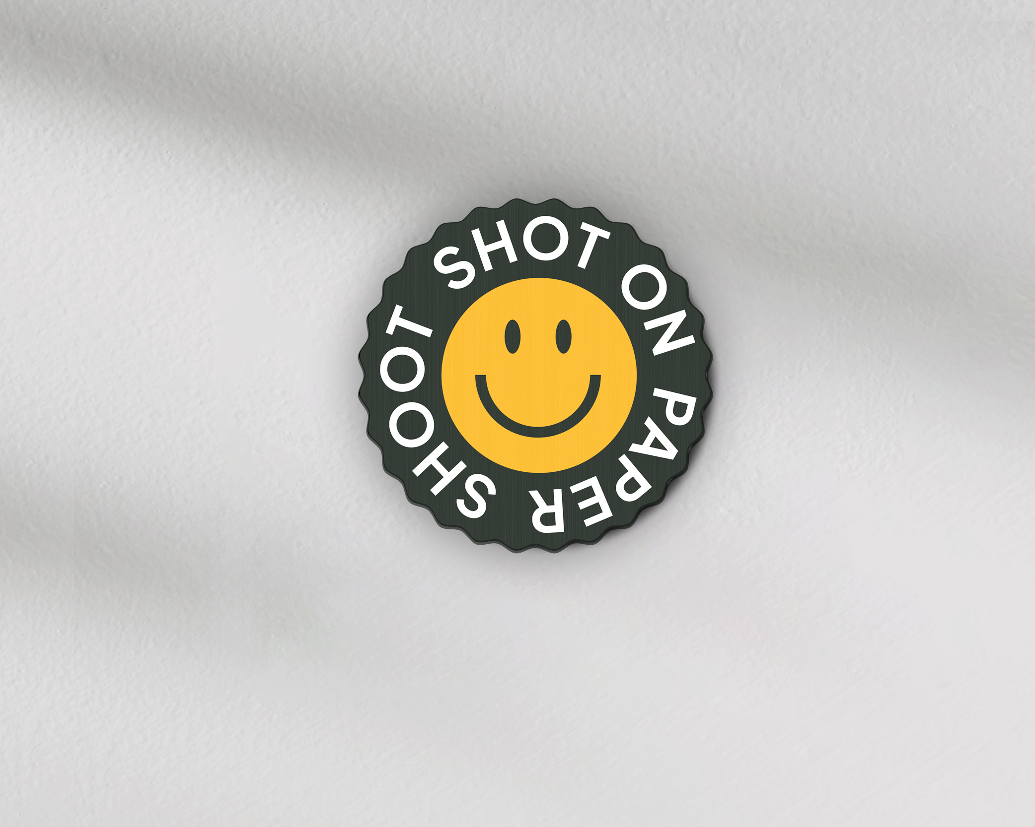 Shot on paper shoot text lens covers with yellow smiley face graphic with grip groves 
